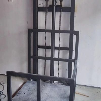 1-12M Alturas de elevación Potencia de acero Control PLC del ascensor de carga hidráulico